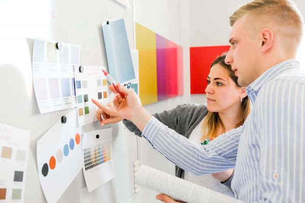 Employee on a project wall in color concept development